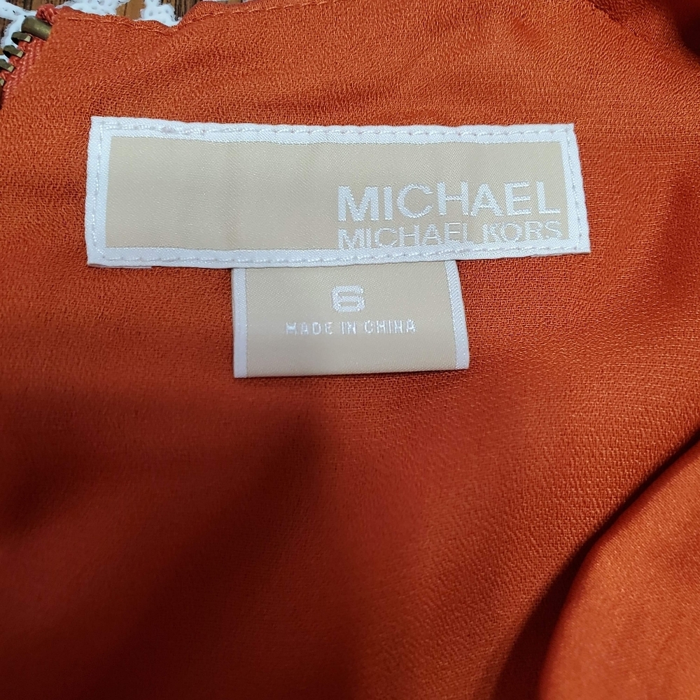 Orange sleeveless blouse